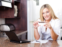 woman holding credit card